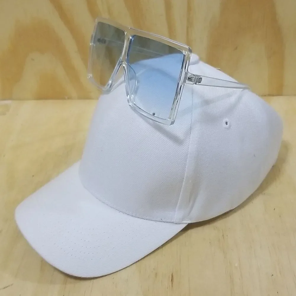 High Fashion Women's Sunglasses with clear frames/ blue tented lenses.